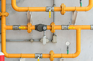 a network of yellow gas pipes with separate safety valves