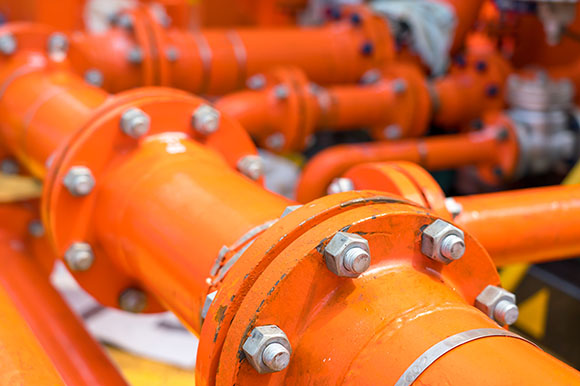 orange gas pipes in a gas system