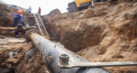 an unearthed gas pipe being repaired